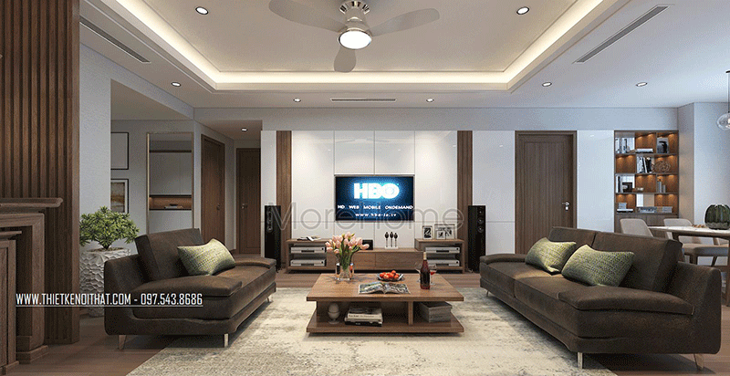 Nổi bật giữa phòng khách là bộ sofa bằng nỉ màu socola và chiếc bàn trà bằng gỗ với thiết kế độc đáo là điểm nhấn cho phòng khách chung cư Hơn 10 mẫu thiét kế Sofa đẹp, ấn tượng và hot nhất